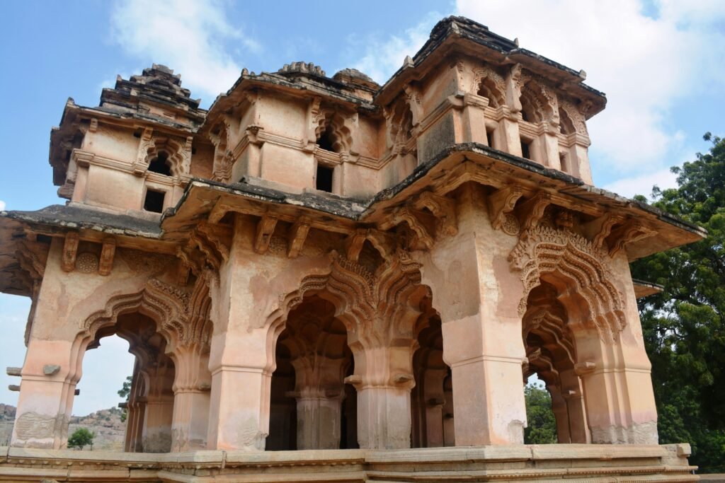Explore the exquisite Indo-Islamic architecture of the Lotus Mahal in Hampi, India.