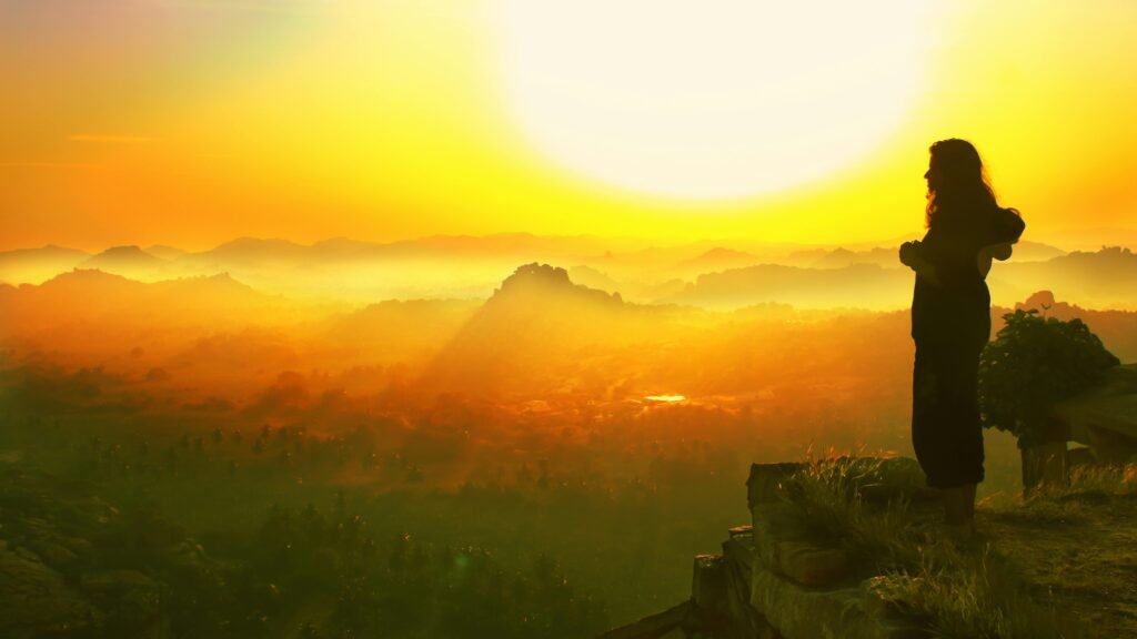 A mesmerizing silhouette view over Hampi's landscape at sunrise, capturing the essence of serenity.